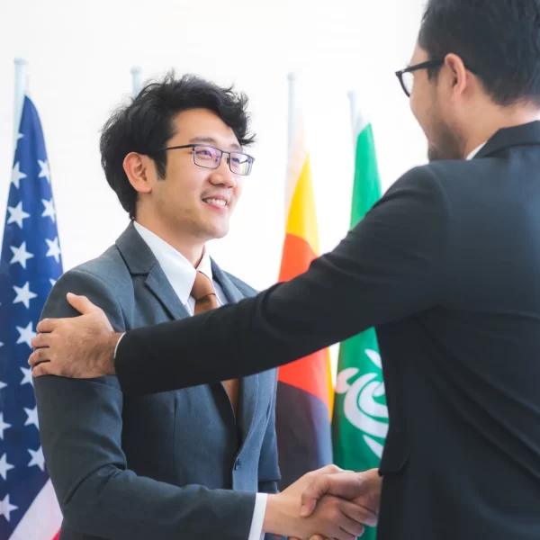 business-people-shake-hands-international-flag-ba-2025-03-25-14-30-10-utc