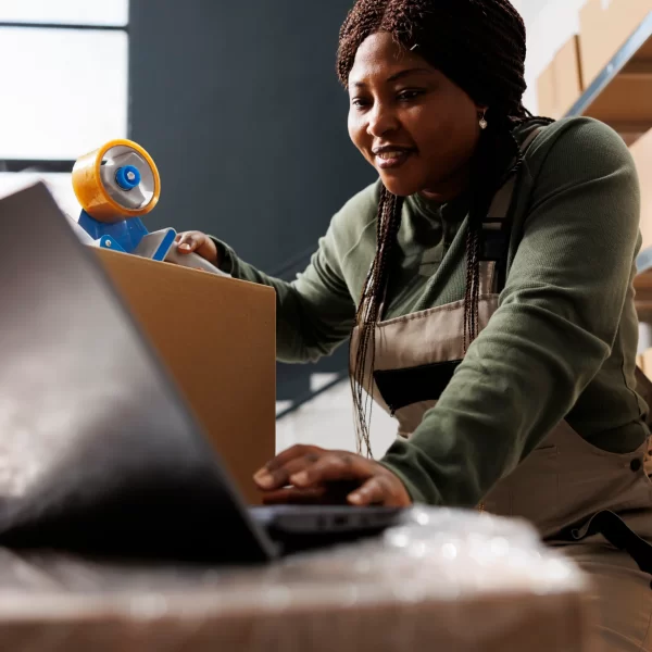 stockroom-worker-analyzing-online-orders-on-laptop-2025-02-25-03-47-32-utc